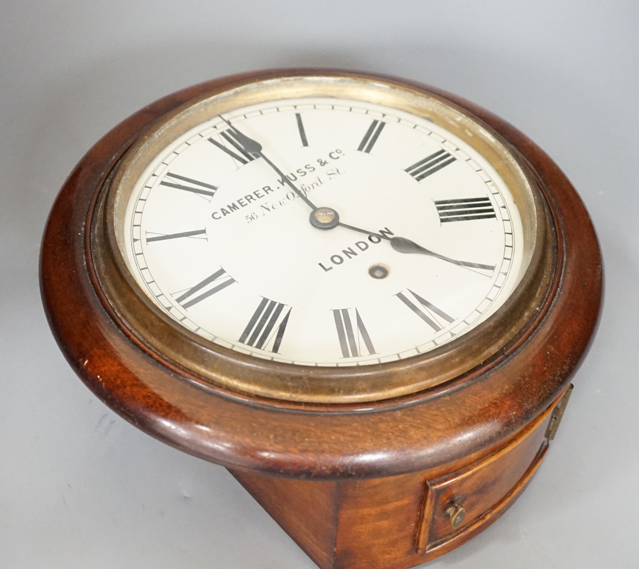 A Camera Kuss & Co. mahogany dial clock, 30 cms diameter.